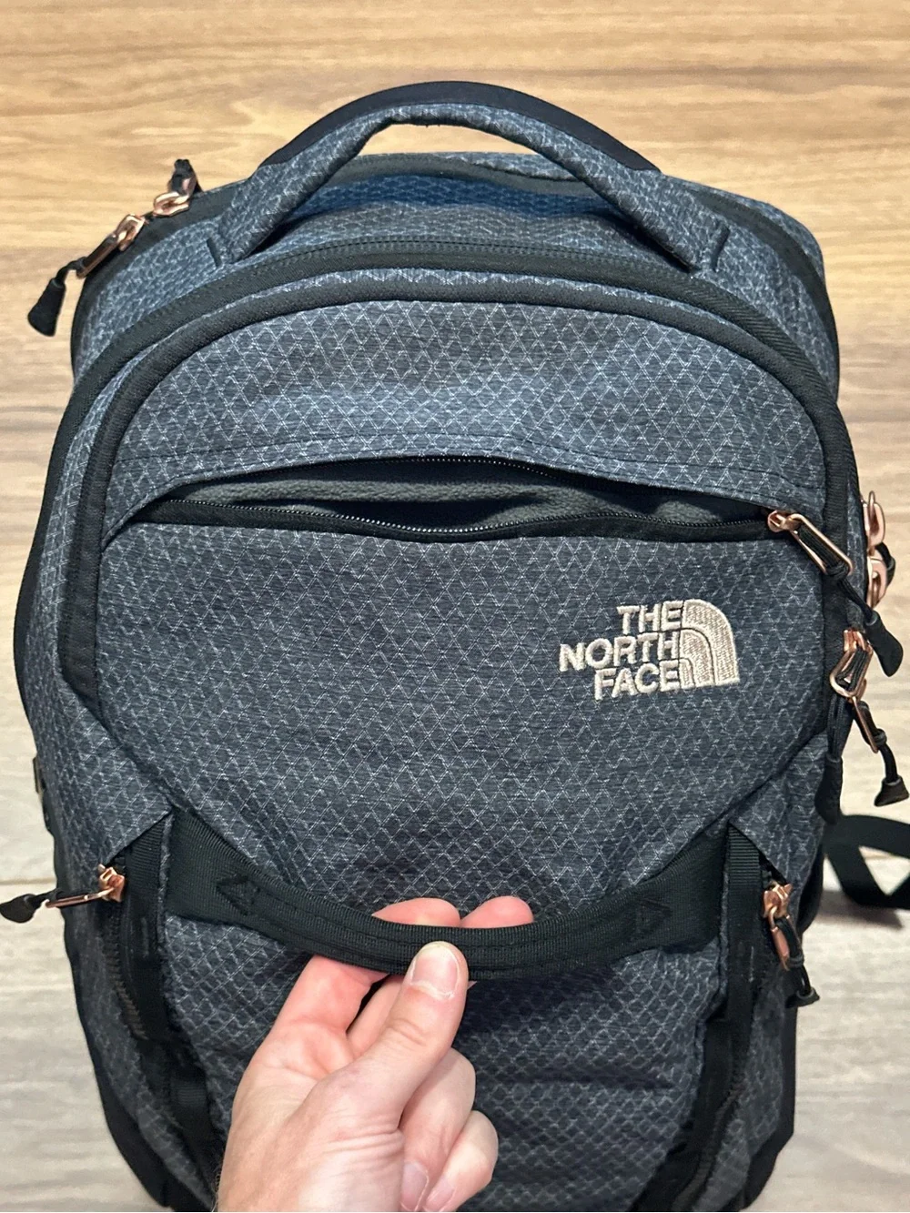 The North Face Surge Backpack in TNF Black Heather Copper/TNF Black